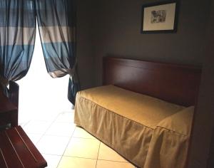 Postel nebo postele na pokoji v ubytování Hotel Taormina