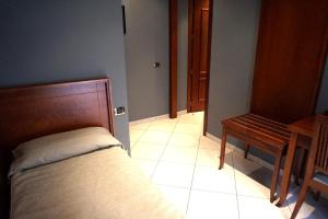 Postel nebo postele na pokoji v ubytování Hotel Taormina