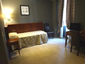Postel nebo postele na pokoji v ubytování Hotel Taormina