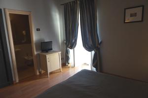 Postel nebo postele na pokoji v ubytování Hotel Taormina