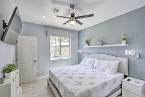 a bedroom with a bed and a ceiling fan at Modern Las Vegas Getaway 10 Mi to The Strip! in Las Vegas