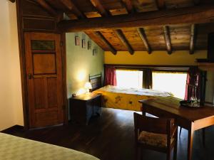 Postel nebo postele na pokoji v ubytování B&B Ai Tre Confini