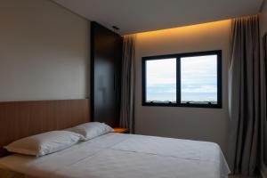 Säng eller sängar i ett rum på Salinas Premium Resort