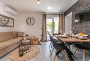 a living room with a couch and a table at MariLu Luxury Apartments in Drage