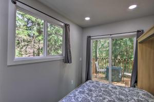 A bed or beds in a room at Unique Container Studio with Deck and Fire Pit!