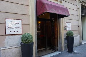 a store front with a window with a sign on it at Hotel Mariano in Rome