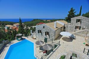 an external view of a villa with a swimming pool at Villa Katerini in Gaios