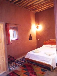 Katil atau katil-katil dalam bilik di Authentic riad & activities Erg