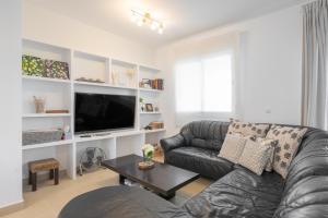 Televízia a/alebo spoločenská miestnosť v ubytovaní Magnífico apartamento en el Rincón by Renthas
