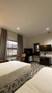 Een bed of bedden in een kamer bij Beautat Hotel