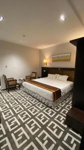 מיטה או מיטות בחדר ב-Beautat Hotel
