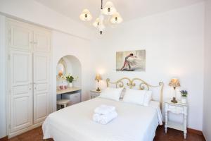 Posteľ alebo postele v izbe v ubytovaní Hotel Odysseus