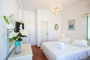 Posteľ alebo postele v izbe v ubytovaní Hotel Odysseus