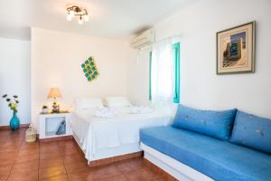 Posteľ alebo postele v izbe v ubytovaní Hotel Odysseus