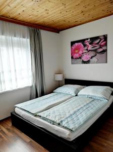 מיטה או מיטות בחדר ב-Sigi Apartment