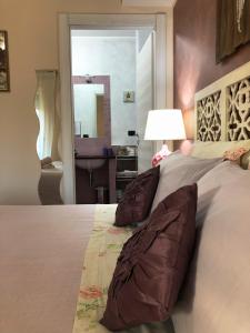 A bed or beds in a room at Rizzi Marianna B&B