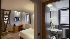 Posteľ alebo postele v izbe v ubytovaní Hotel 99 Cannelle