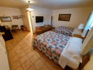 Postel nebo postele na pokoji v ubytování Cactus Inn