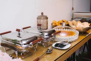 a table topped with bread and a cake on top at Casa do Passadiço - Alvarenga in Alvarenga