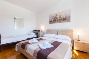 Posteľ alebo postele v izbe v ubytovaní Oleander Apartment