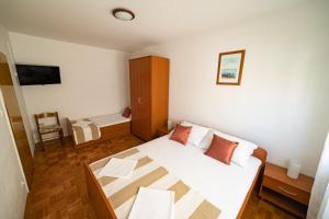 Postel nebo postele na pokoji v ubytování Apartments M&S