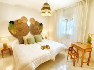 a bedroom with a bed with a large wooden headboard at AQUI Brioca in Fuentes de la Alcarria