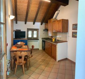 a kitchen with wooden cabinets and a wooden table at Geppo San Domenico in San Domenico