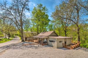 a small house in the middle of a road at Stunning 2-Building Rental - Walk to Marina! in Celina
