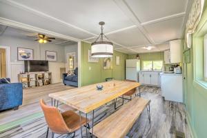 a kitchen and living room with a wooden table and chairs at Stunning 2-Building Rental - Walk to Marina! in Celina