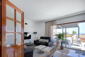 A seating area at Villa Galasol with heated pool