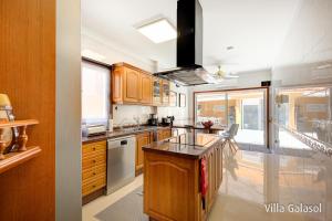 A kitchen or kitchenette at Villa Galasol with heated pool