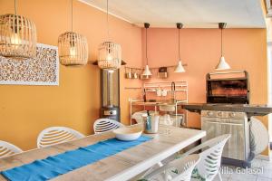 A kitchen or kitchenette at Villa Galasol with heated pool