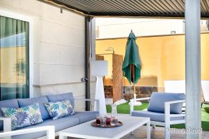 A seating area at Villa Galasol with heated pool