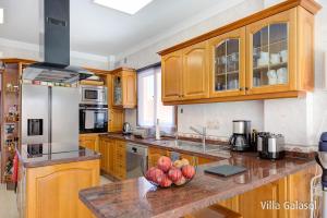 A kitchen or kitchenette at Villa Galasol with heated pool