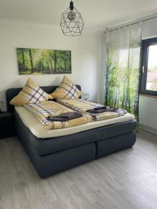 Postel nebo postele na pokoji v ubytování Ferienhaus-Weitsicht