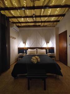 Ένα ή περισσότερα κρεβάτια σε δωμάτιο στο Poseidon Rooms 