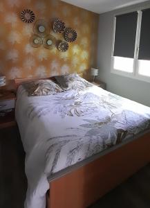 מיטה או מיטות בחדר ב-Le PATSA de Vouillé