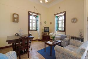 a living room with a couch and a table at Algarve Charming 2br Colonial Villa in Santa Bárbara de Nexe