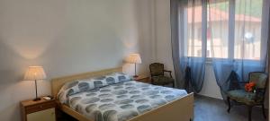 Postel nebo postele na pokoji v ubytování SUNNY HOLIDAY HOME