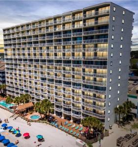 an aerial view of a large building with a beach at 0206 Waters Edge Resort condo in Myrtle Beach