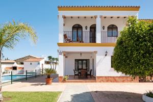 a villa with a view of the swimming pool at El Huerto - Sólo Familias in Roche