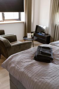 En eller flere senge i et værelse på De la Rue Vakantiesuites