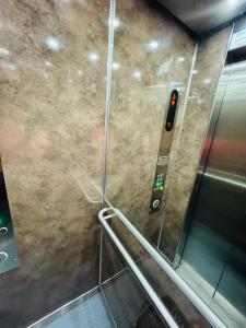 an elevator with an escalator in a subway train at SunnyF2- EuroAiport-Basel-TrainStation-CityCenter in Saint-Louis