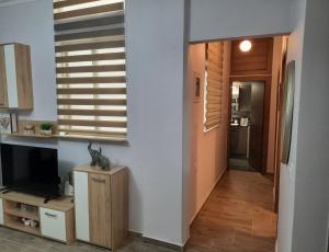Televízia a/alebo spoločenská miestnosť v ubytovaní SummerSense Apartment