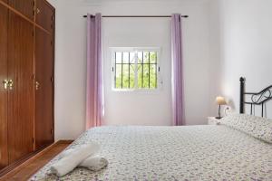 Postel nebo postele na pokoji v ubytování Villa Zajara