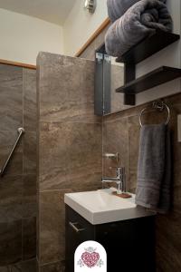 a bathroom with a sink and a toilet in it at Hotel Corazón de Plata Centro in Guanajuato