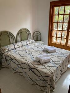 Llit o llits en una habitació de Chalet a 100m de la playa de Cristal, Pino Alto