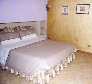 A bed or beds in a room at Ciuri Ciuri