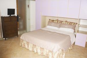 A bed or beds in a room at Ciuri Ciuri