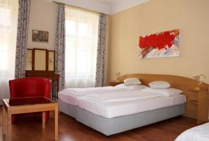 Ένα ή περισσότερα κρεβάτια σε δωμάτιο στο Hotel Graf Stadion